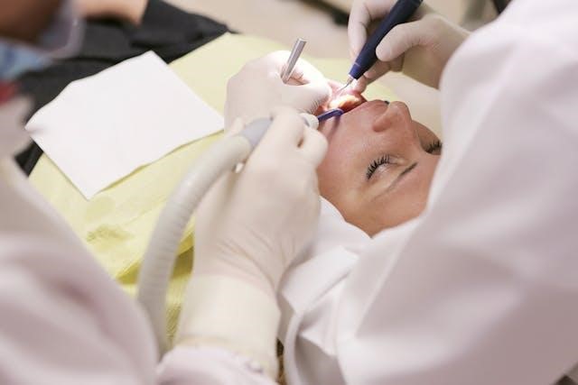 A woman getting examined by a dentist